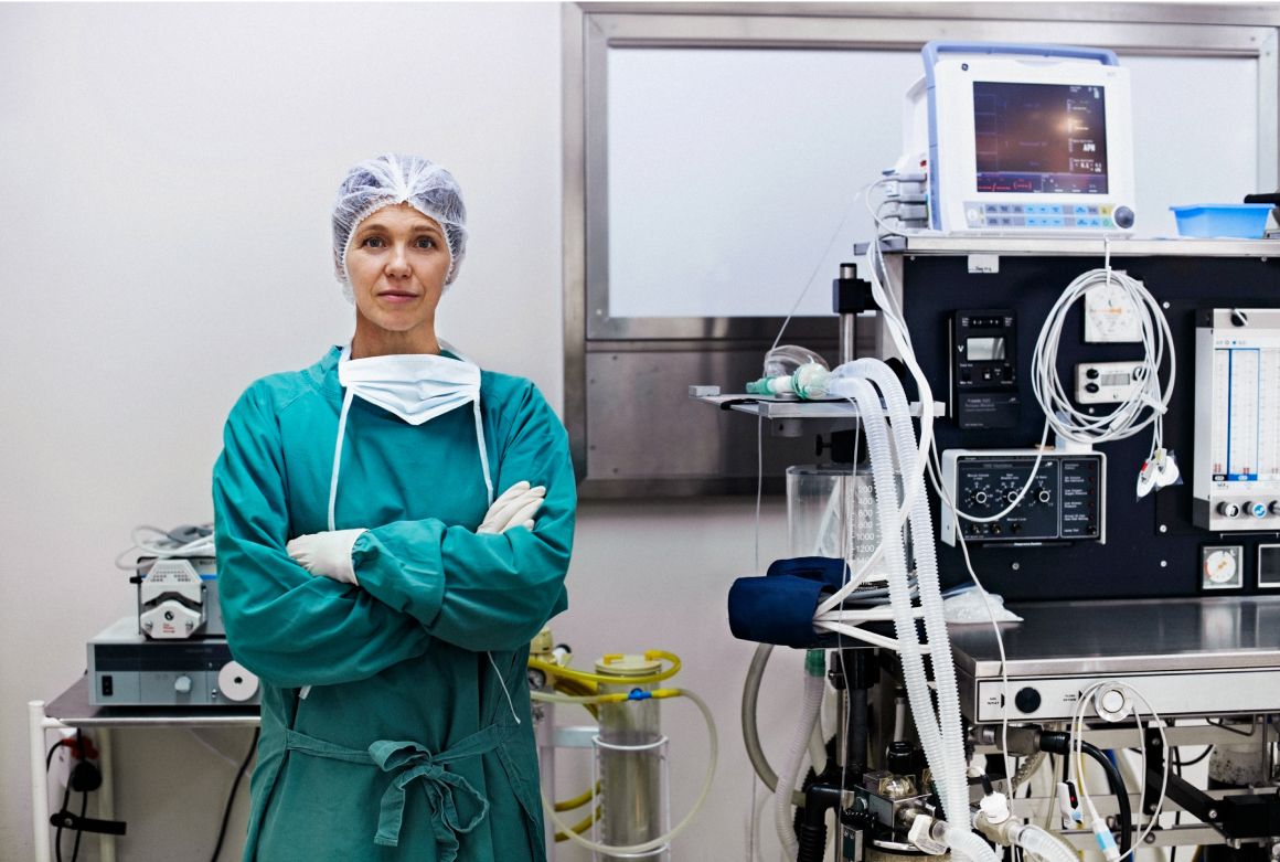 Heroic portrait of female surgeon in an operating room.